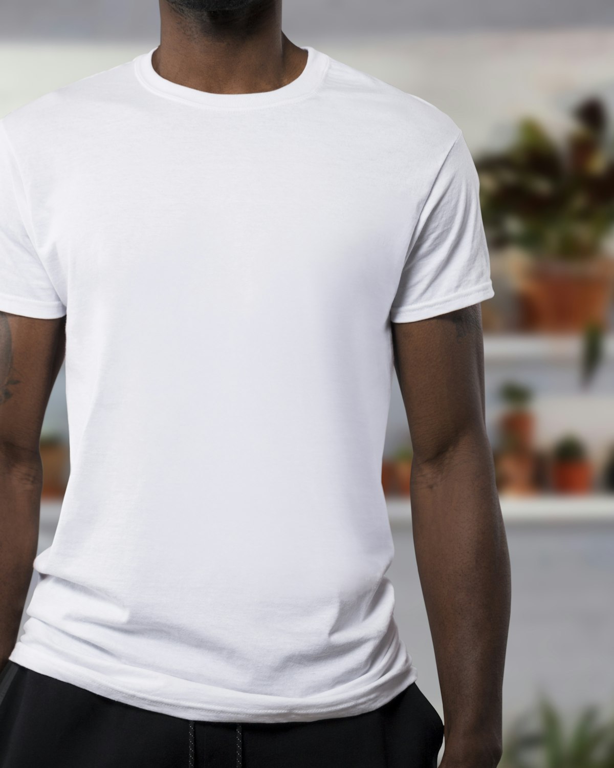 Man wearing a white Jup organic cotton t-shirt