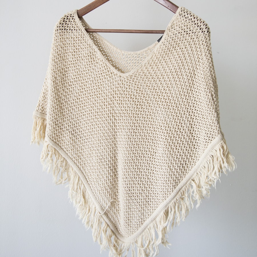 Jup fringed knit poncho in cream